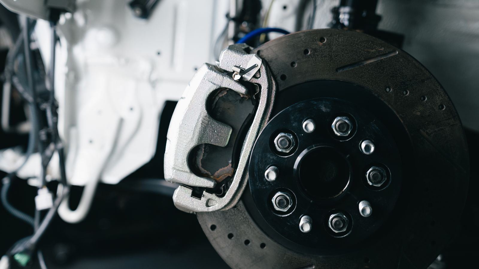 Close-up of a car brake caliper and disc rotor